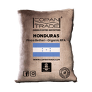 Coffee bag from Copan Trade with Honduras branding and flag on a green background