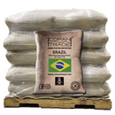Green coffee bag on a pallet with label Brazil BRAZIL Sítio Serra da Conceição NY 2 Sc 17 18